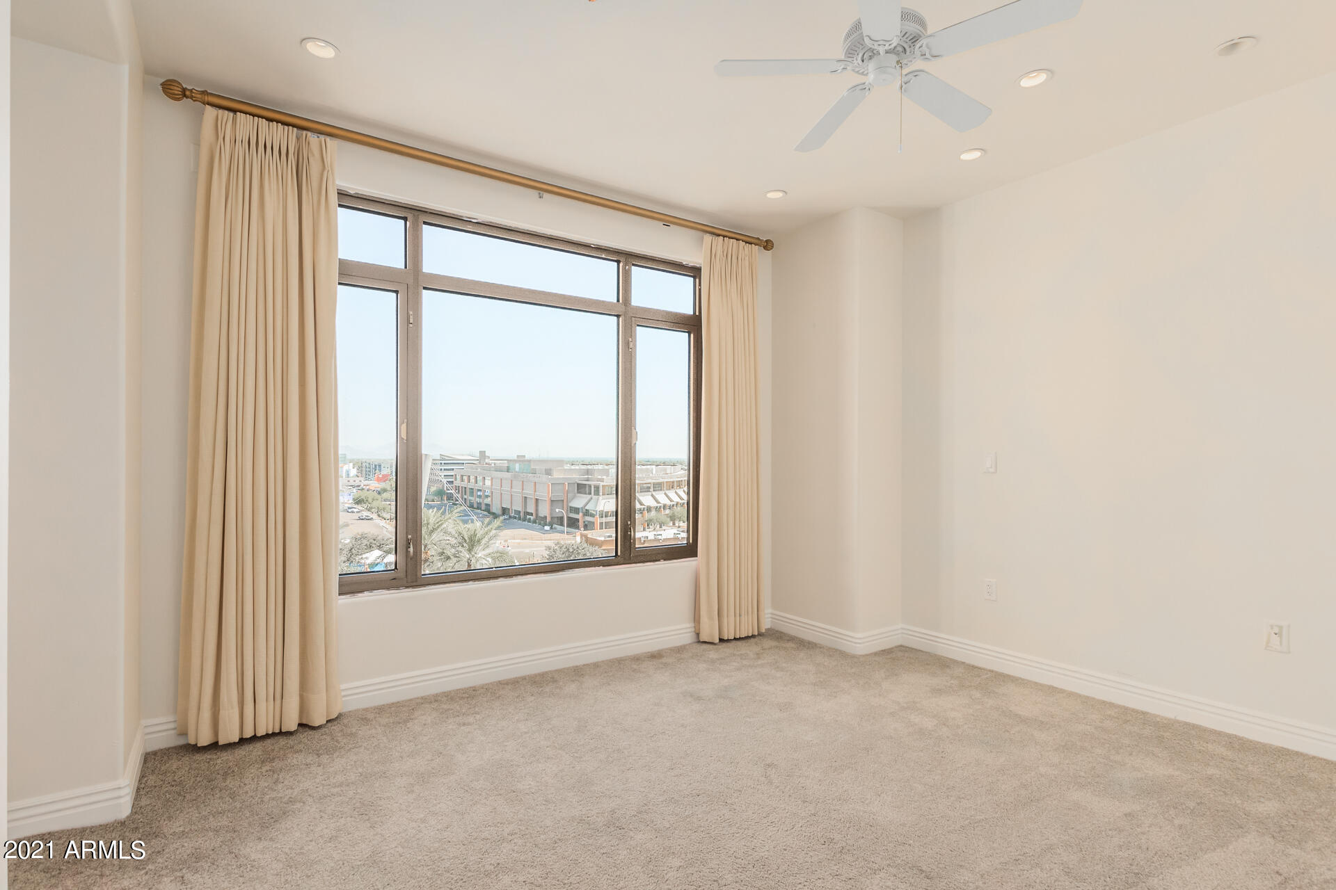 7175 East Camelback Road, Unit 707 Scottsdale, AZ 85251 - Photo 15 of 31 an empty room with a window