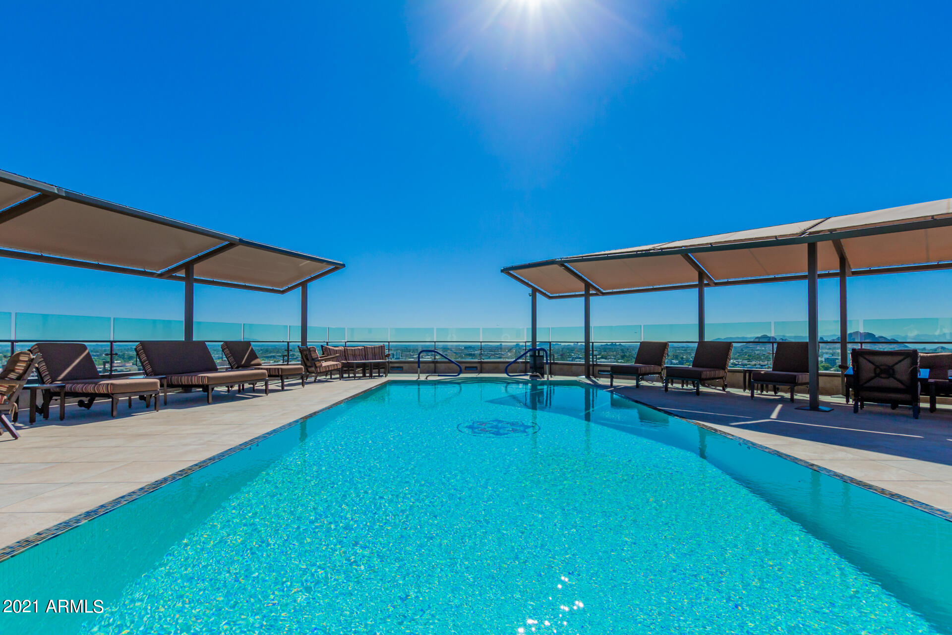 7175 East Camelback Road, Unit 707 Scottsdale, AZ 85251 - Photo 22 of 31 a view of a backyard with swimming pool and sitting area