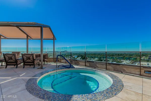 a view of a swimming pool with a patio
