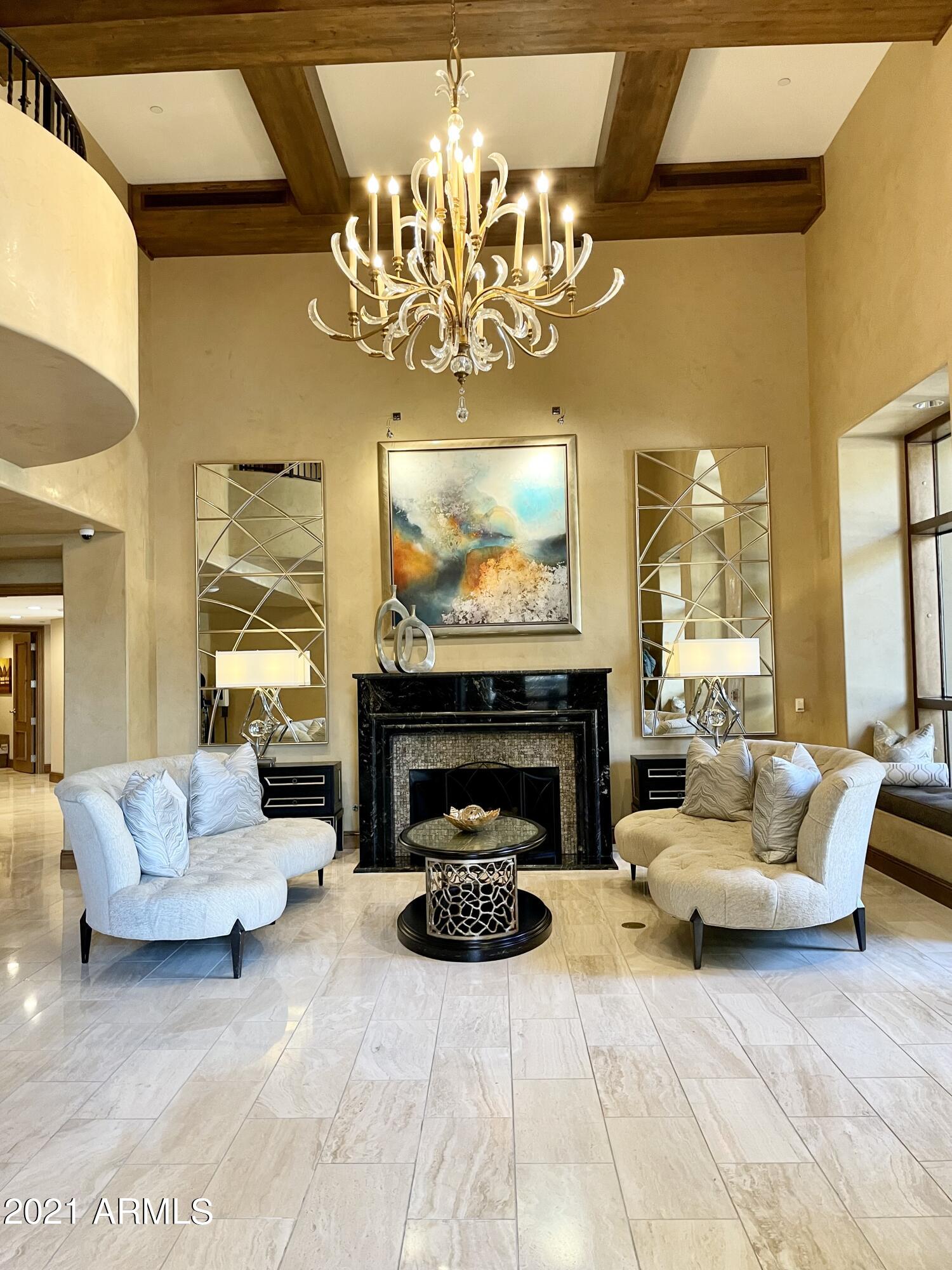 7175 East Camelback Road, Unit 707 Scottsdale, AZ 85251 - Photo 28 of 31 a living room with furniture and a fireplace