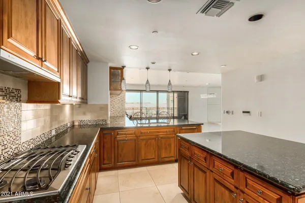a kitchen with a sink stove and cabinets