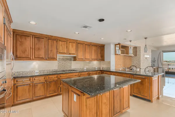 a kitchen filled counter top space a sink a cabinets and appliances