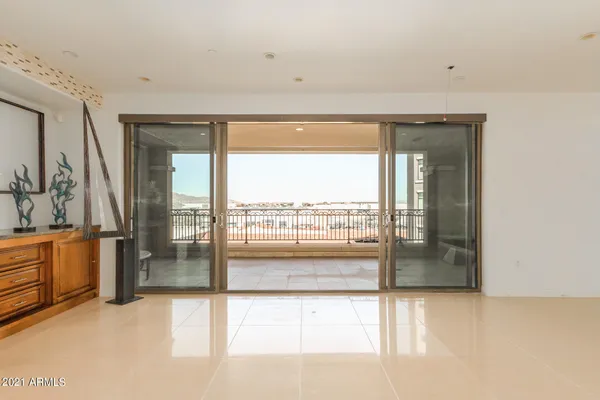 a living room with hardwood floor and furniture