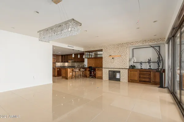 a view of a livingroom with furniture and a flat screen tv
