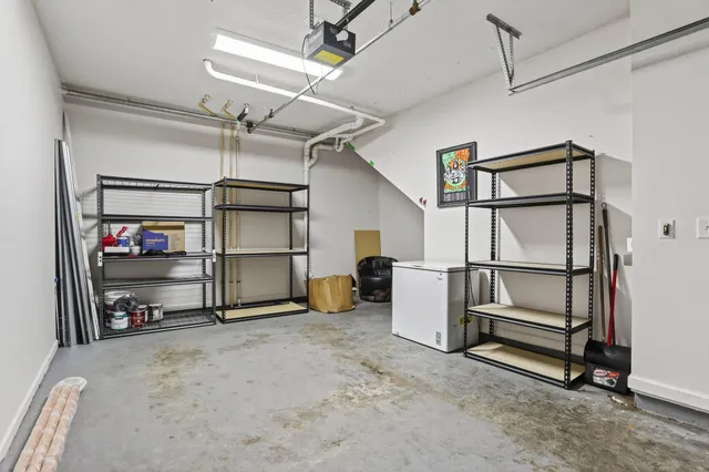 a view of a storage & utility room with racks on the wall