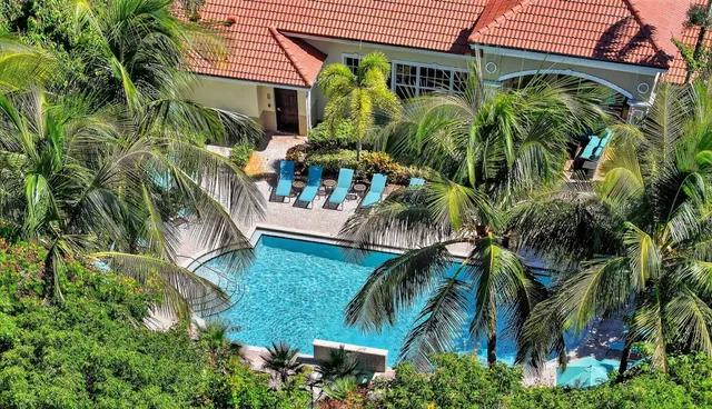 a view of a swimming pool with a patio