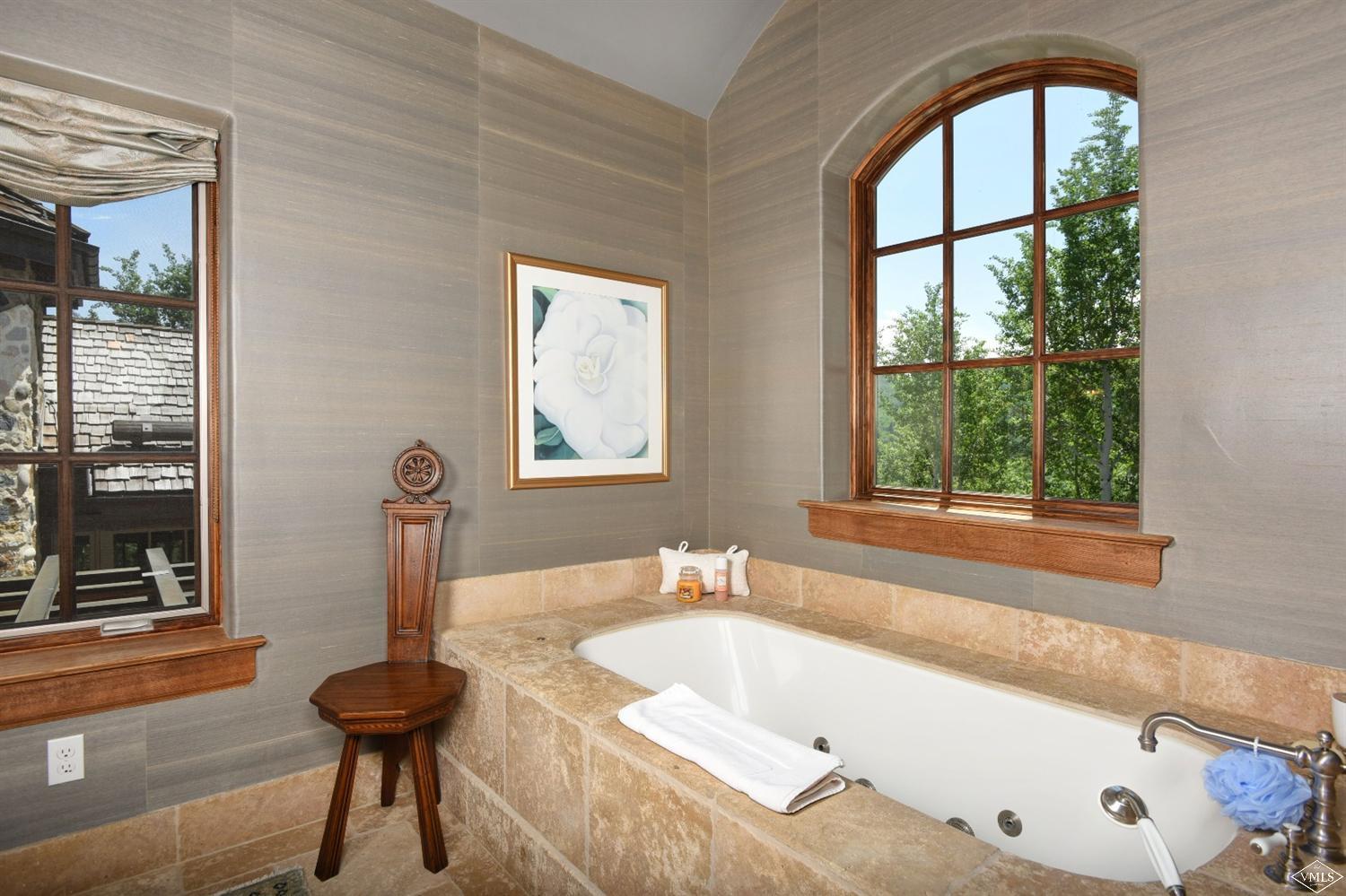 262 Borders Road Beaver Creek, CO 81620 - Photo 15 of 25 a bathroom with a bathtub and window