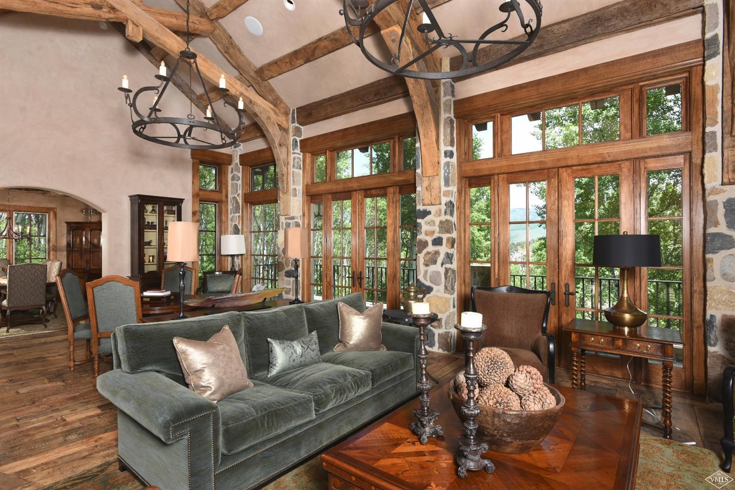 262 Borders Road Beaver Creek, CO 81620 - Photo 7 of 25 a living room with furniture a chandelier and a large window