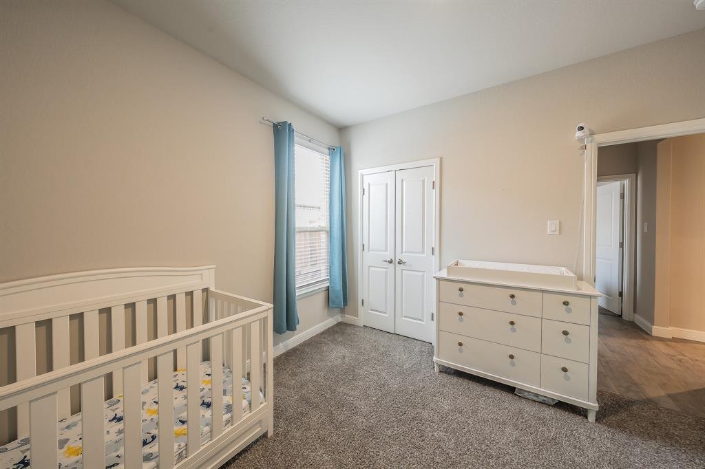 1212 Bosque Lane Weatherford, TX 76087 - Photo 32 of 38 a view of a bedroom with baby crib