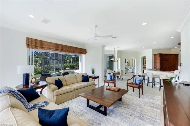 a living room with furniture fireplace and window