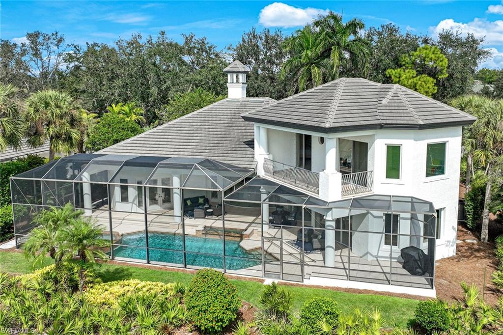1483 Gormican Lane Naples, FL 34110 - Photo 2 of 11 a view of a house with a yard