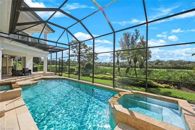 a view of a backyard with sitting area