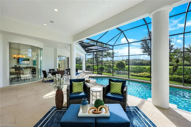 a view of a backyard with swimming pool