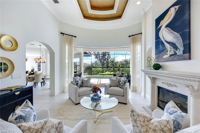 a dining room with furniture a chandelier and fireplace