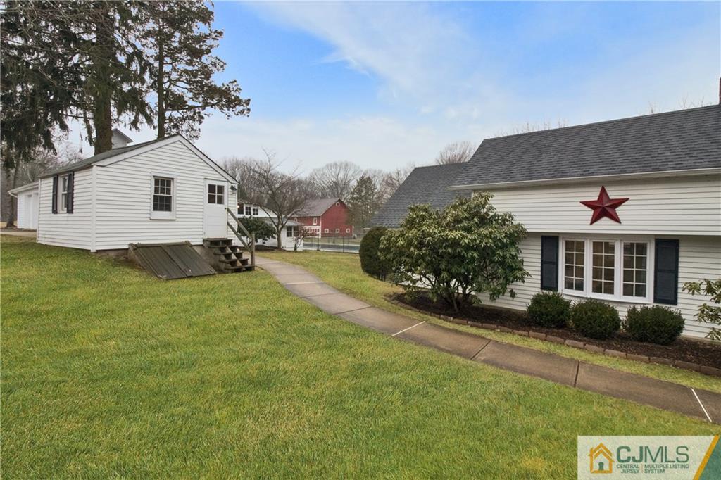 19 Reids Hill Road Morganville, NJ 07751 - Photo 2 of 24 a view of a house with a yard