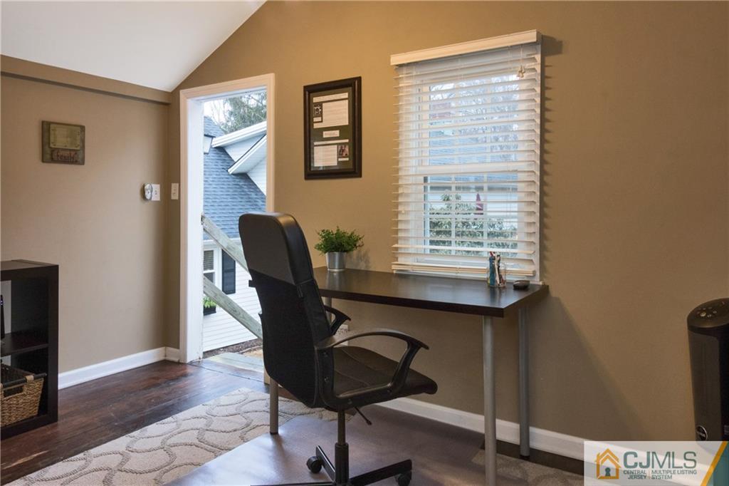 19 Reids Hill Road Morganville, NJ 07751 - Photo 12 of 24 a workspace with furniture and a window