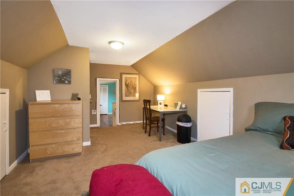 19 Reids Hill Road Morganville, NJ 07751 - Photo 16 of 24 a bedroom with a bed and furniture