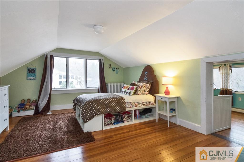 19 Reids Hill Road Morganville, NJ 07751 - Photo 17 of 24 a bedroom with a bed and a window