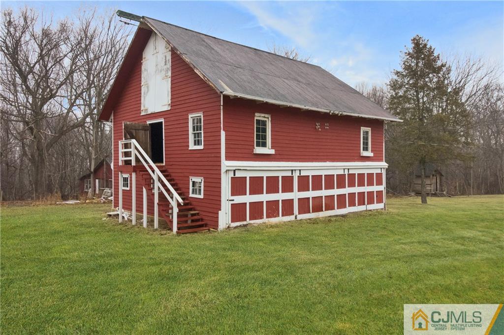 19 Reids Hill Road Morganville, NJ 07751 - Photo 20 of 24 a view of a house with a yard and deck