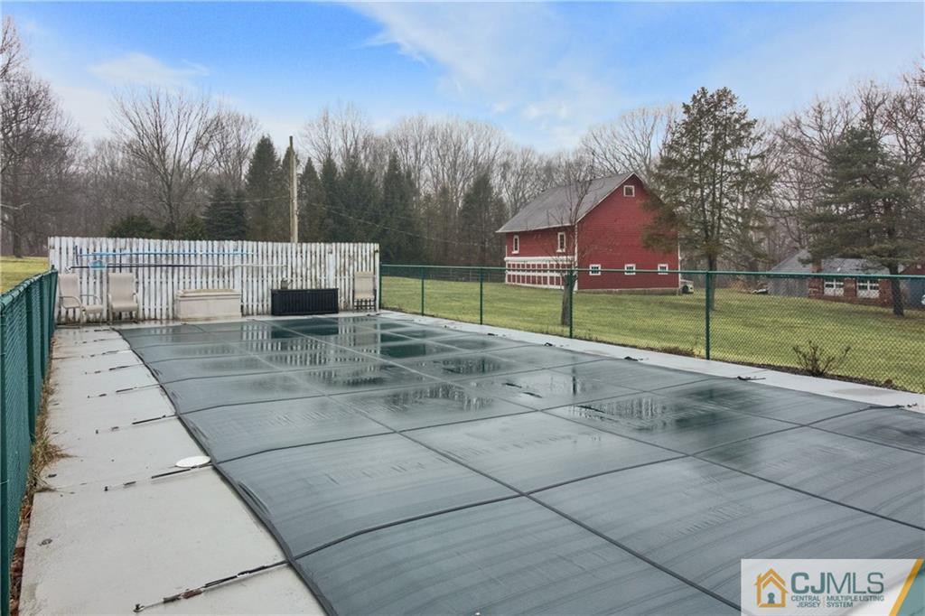 19 Reids Hill Road Morganville, NJ 07751 - Photo 22 of 24 a view of a house with backyard and tree