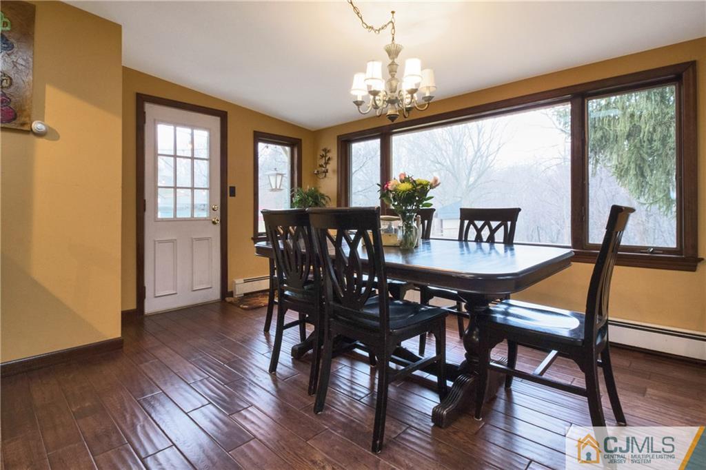 19 Reids Hill Road Morganville, NJ 07751 - Photo 7 of 24 a view of a dining room with furniture window and wooden floor