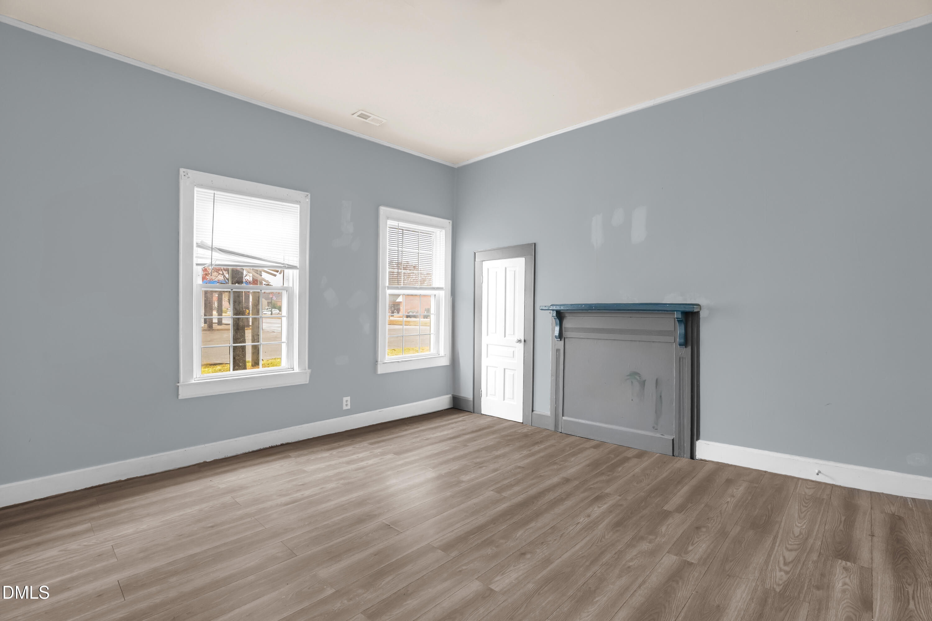 201 East H Street Erwin, NC 28339 - Photo 12 of 23 a view of an empty room with wooden floor and a window