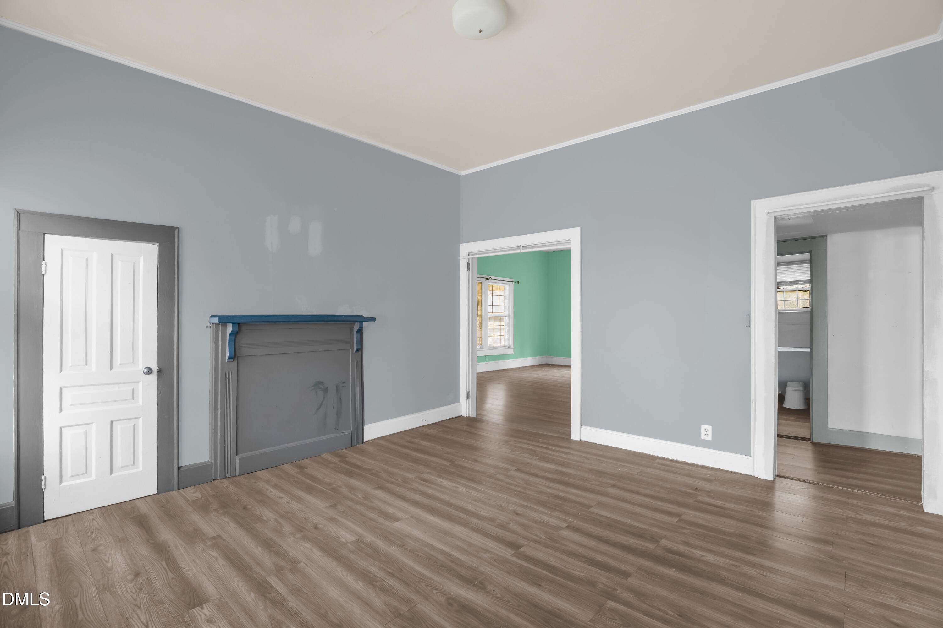 201 East H Street Erwin, NC 28339 - Photo 13 of 23 a view of an empty room with wooden floor and closet