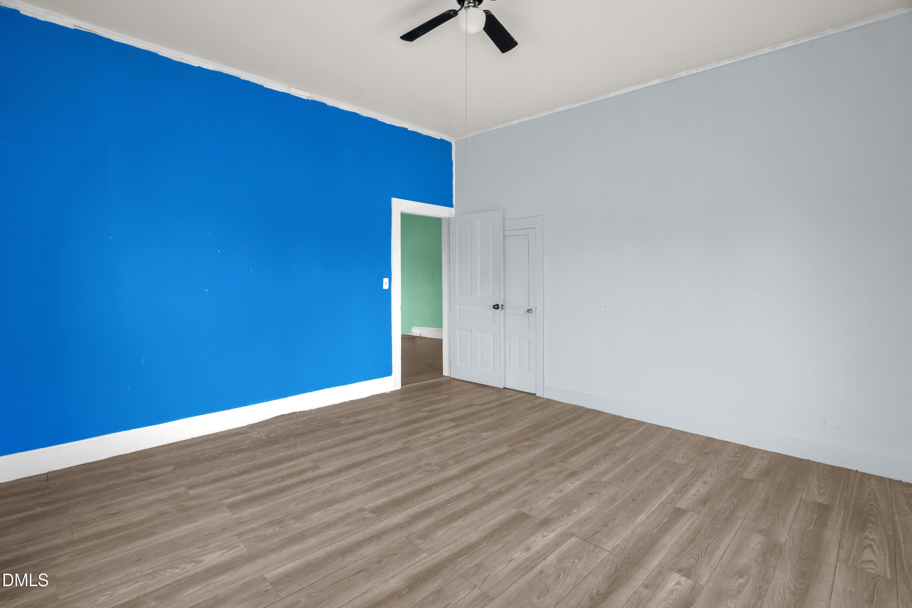201 East H Street Erwin, NC 28339 - Photo 20 of 23 a view of an empty room with wooden floor