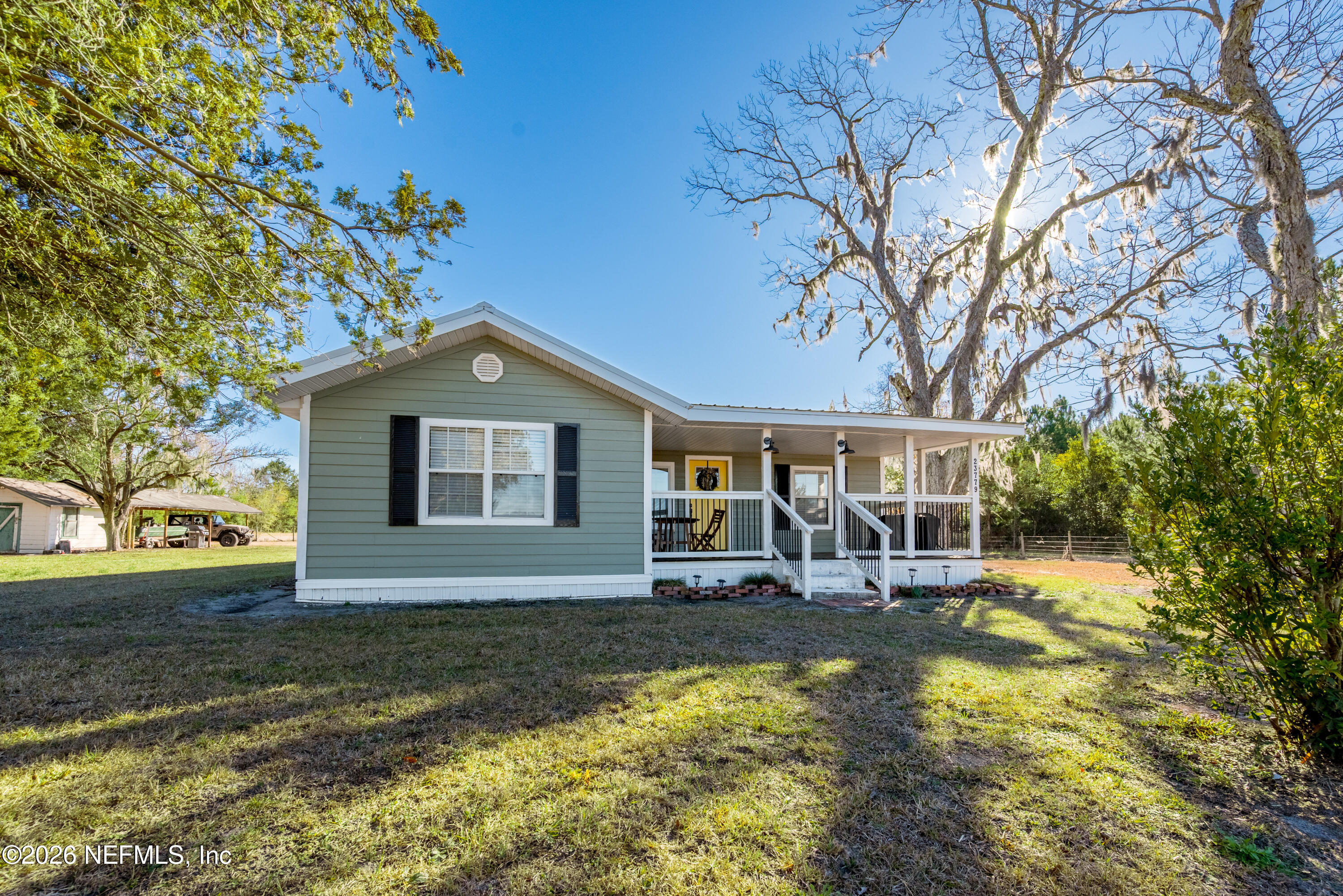 a front view of a house with patio