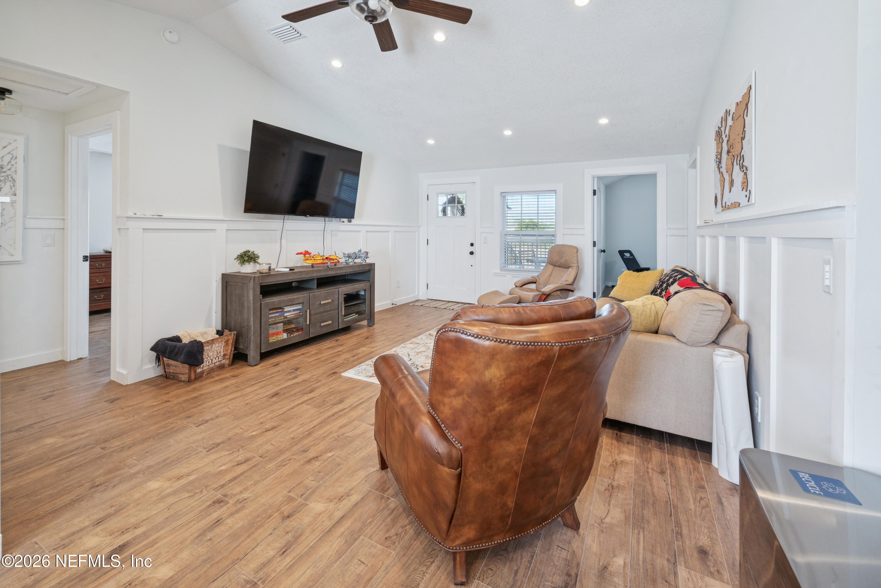 23779 Northwest 225a Road, Unit COUNTY Starke, FL 32091 - Photo 11 of 73 a living room with furniture and a flat screen tv