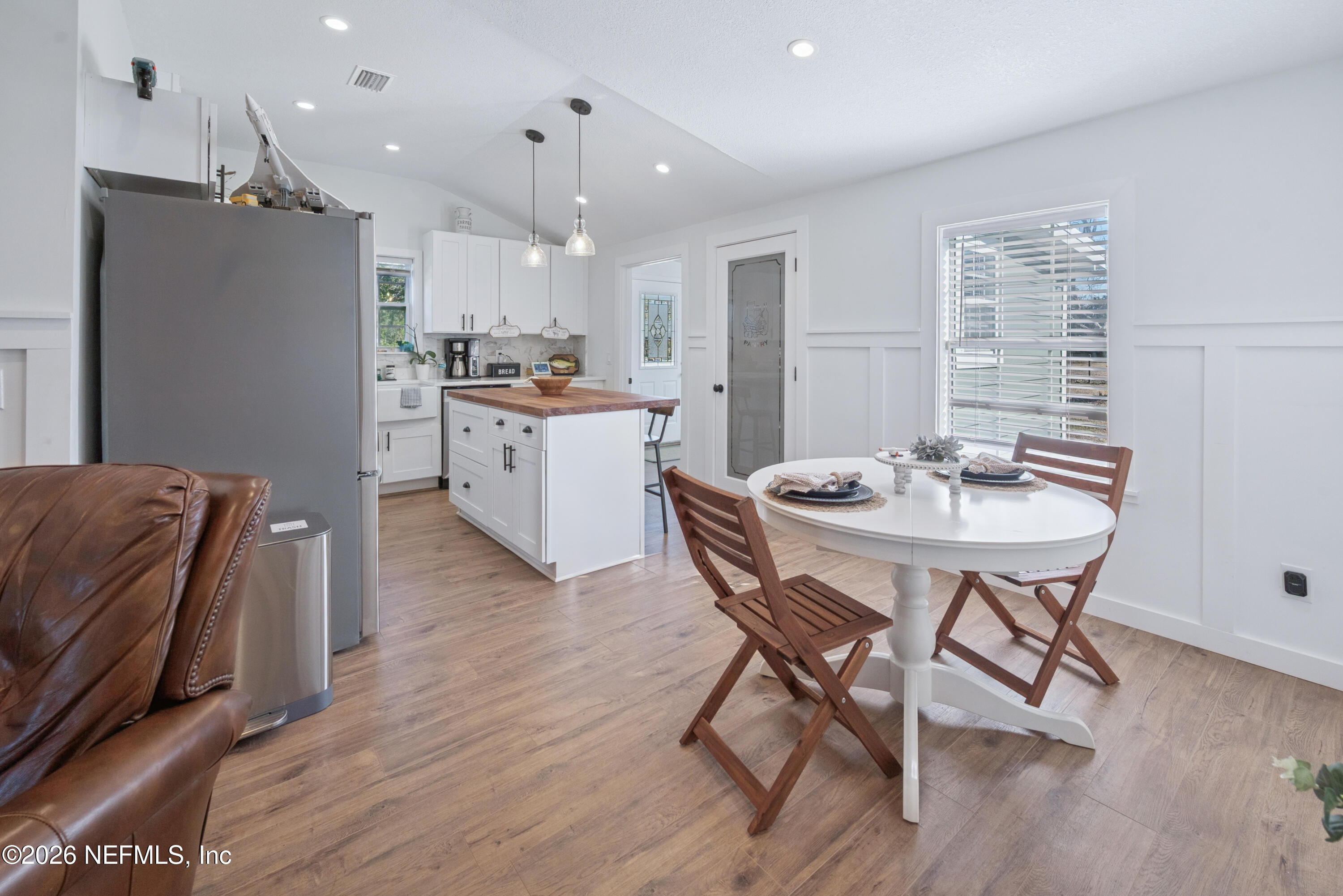 23779 Northwest 225a Road, Unit COUNTY Starke, FL 32091 - Photo 20 of 73 a kitchen with a table and chairs in it