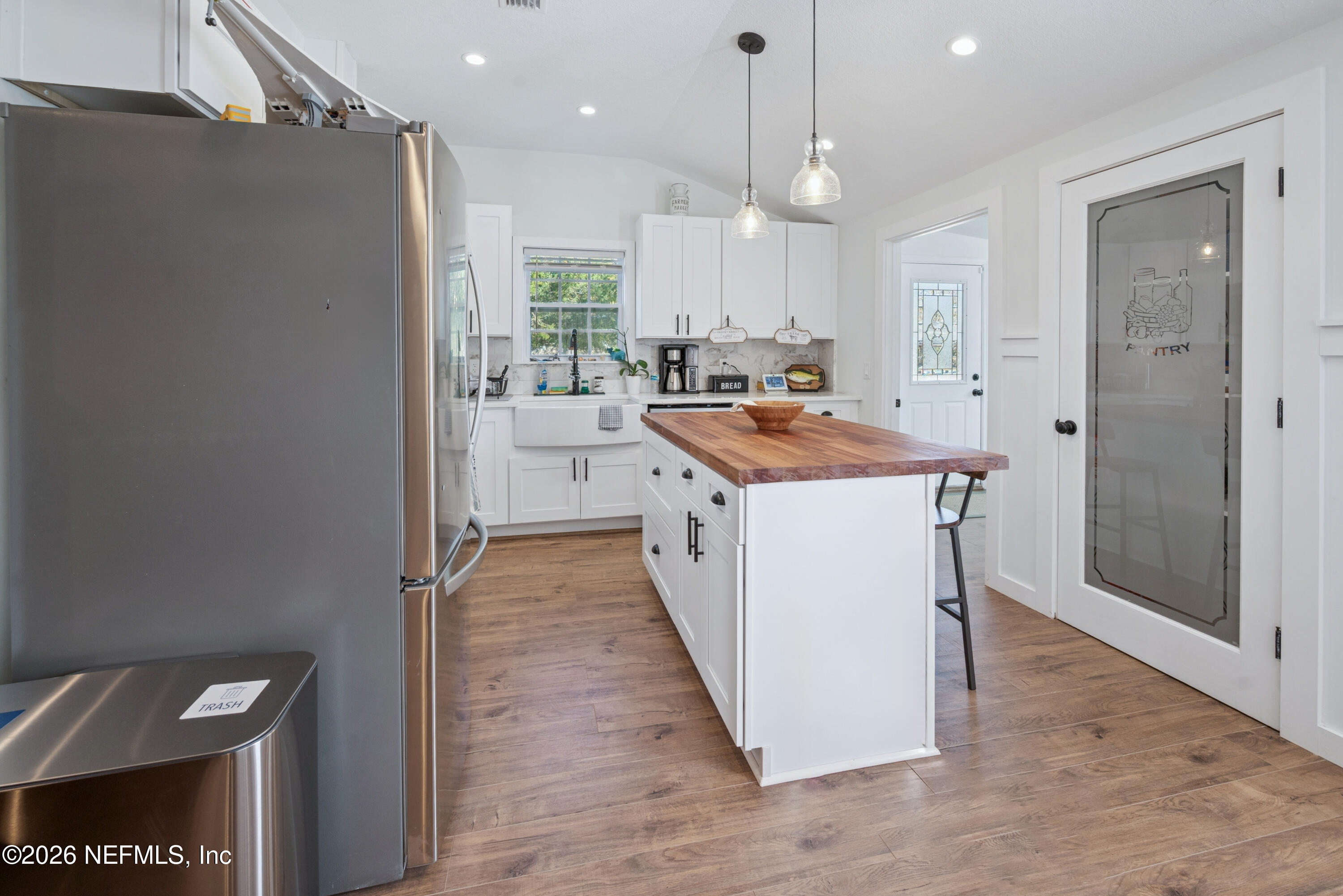 23779 Northwest 225a Road, Unit COUNTY Starke, FL 32091 - Photo 21 of 73 a kitchen with a sink a counter top space and stainless steel appliances