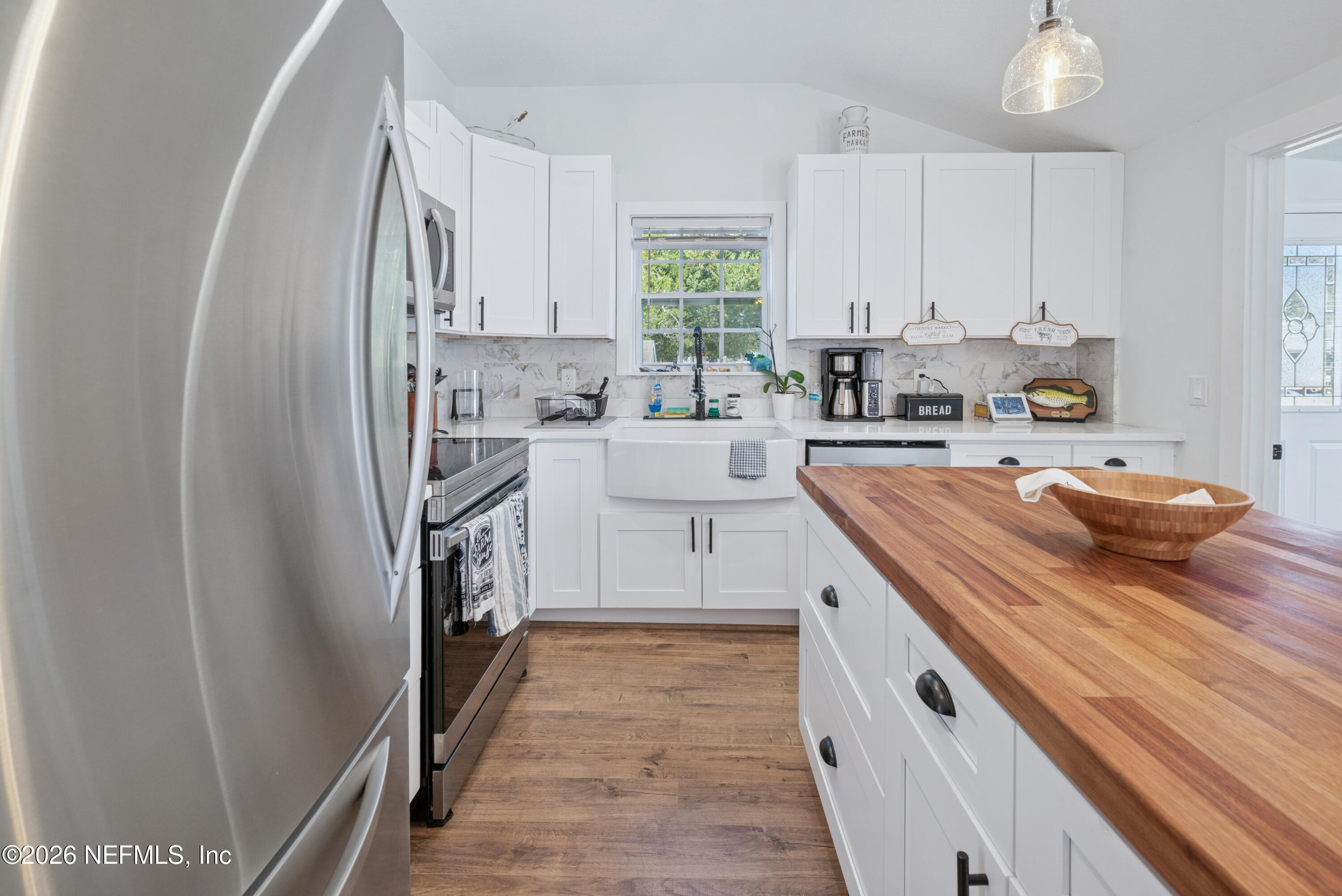 23779 Northwest 225a Road, Unit COUNTY Starke, FL 32091 - Photo 22 of 73 a kitchen with a sink stove and cabinets