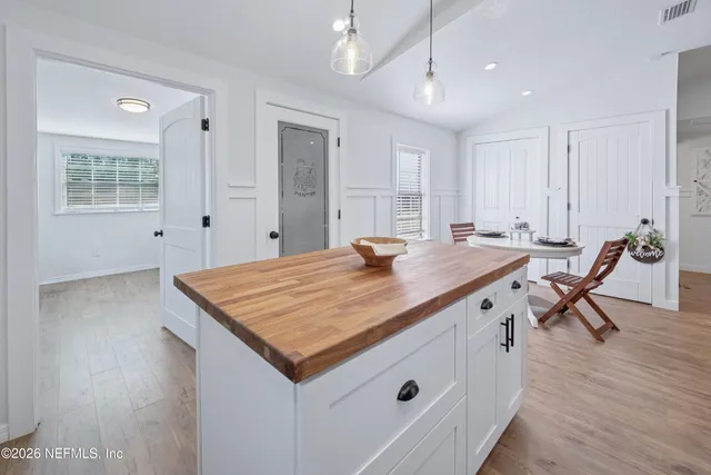 a bathroom with a sink a toilet and shower curtain
