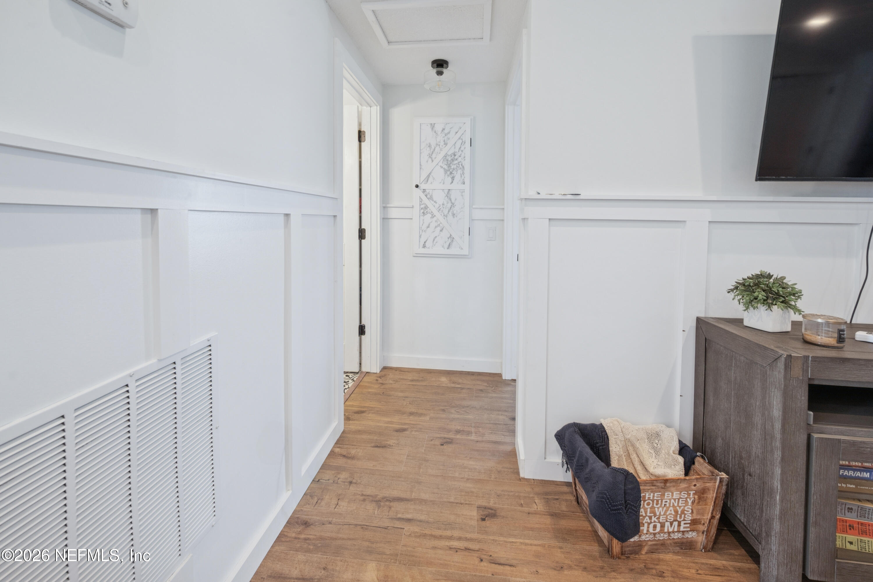 23779 Northwest 225a Road, Unit COUNTY Starke, FL 32091 - Photo 29 of 73 a view of a hallway with wooden floor and closet