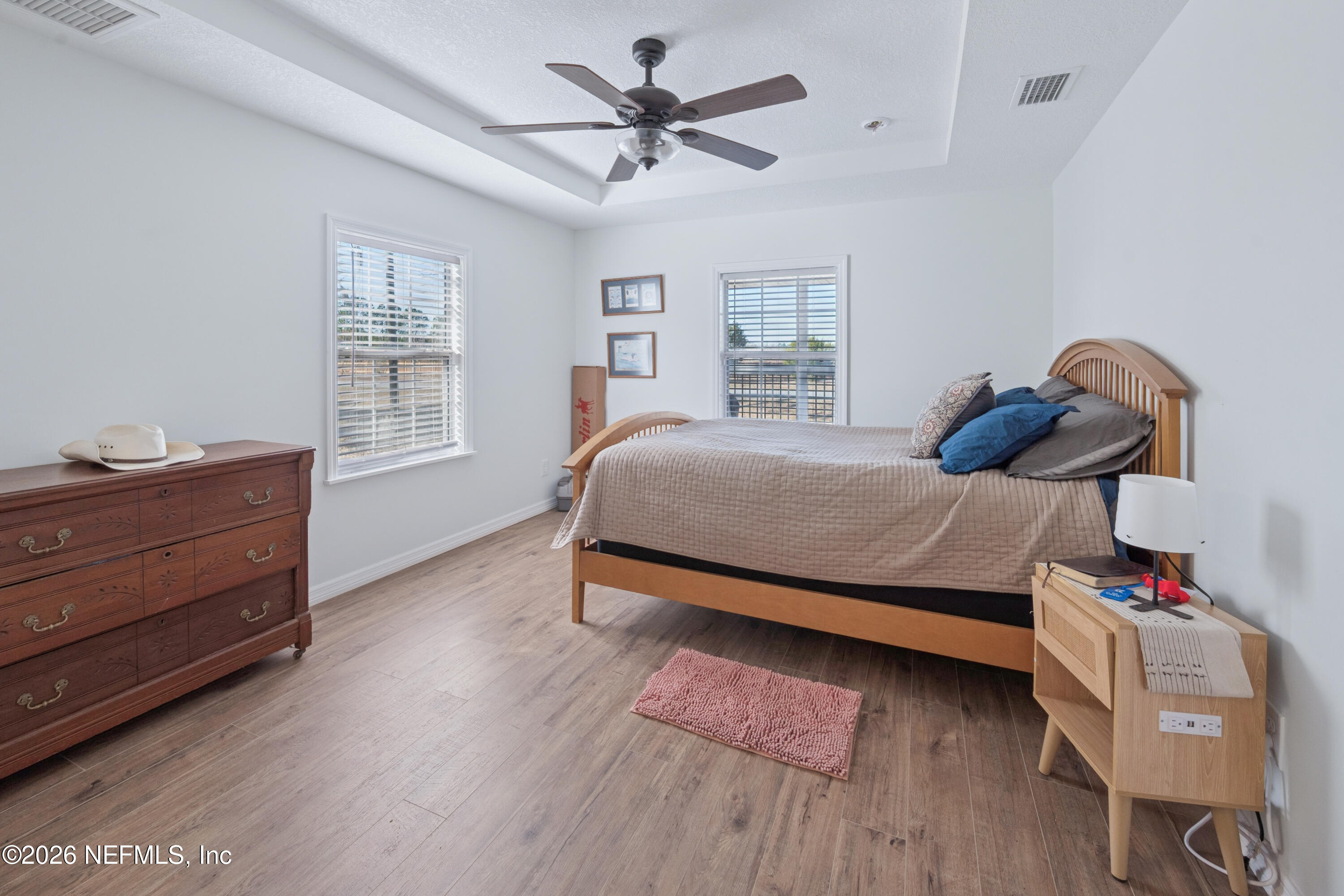 23779 Northwest 225a Road, Unit COUNTY Starke, FL 32091 - Photo 33 of 73 a bedroom with a bed and a window