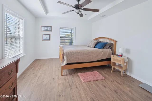 a view of a house with pool and sitting area