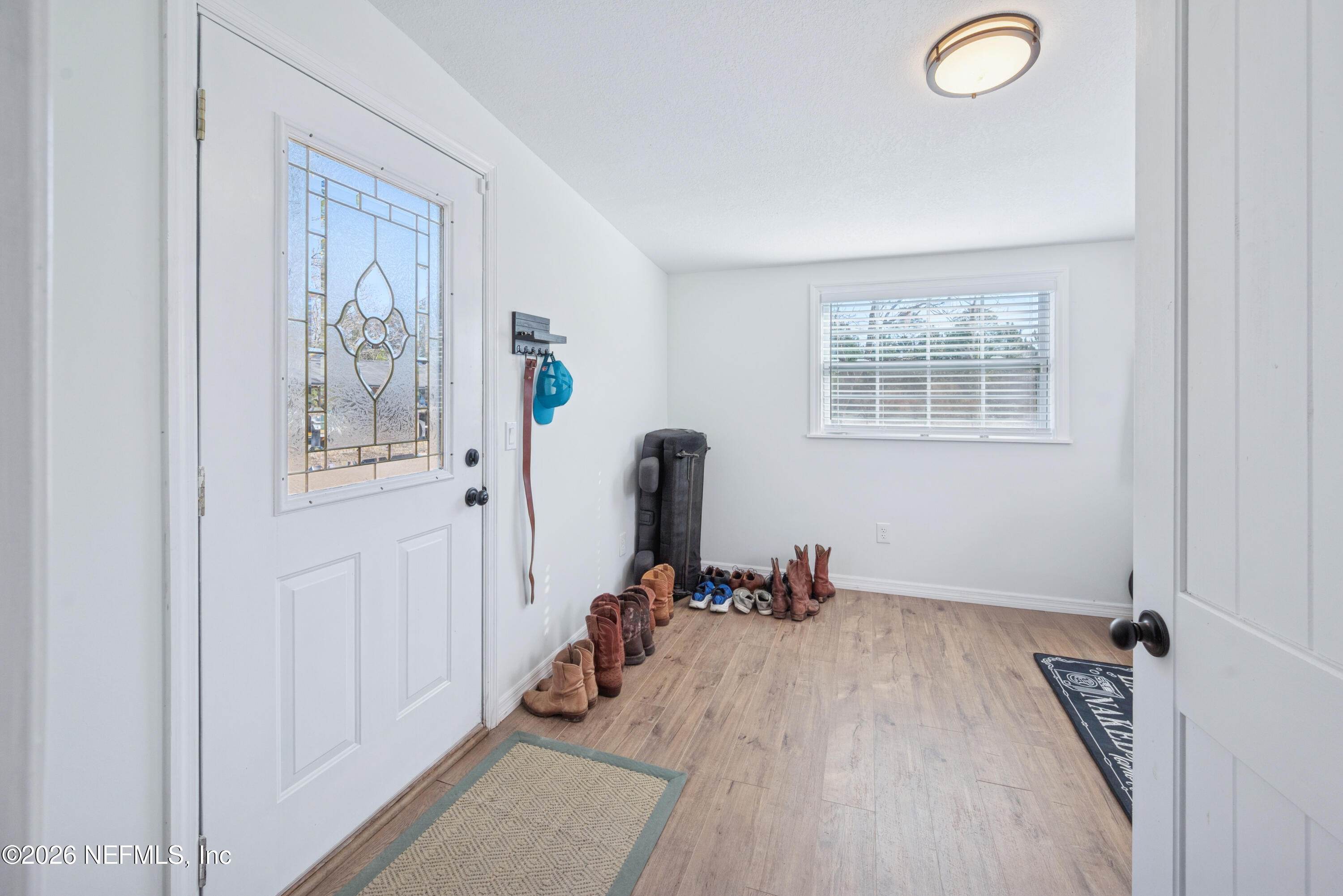 23779 Northwest 225a Road, Unit COUNTY Starke, FL 32091 - Photo 40 of 73 a view of a workspace with furniture and a window