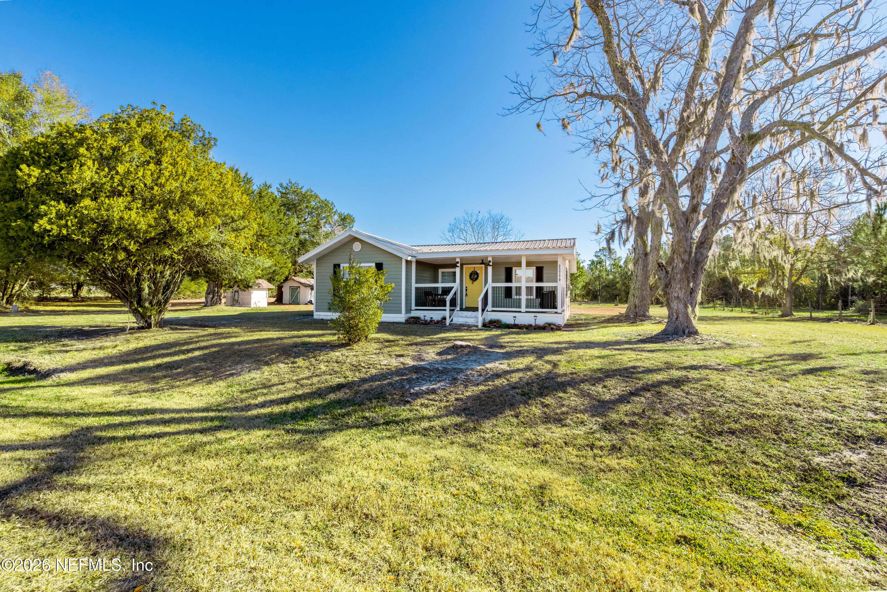 23779 Northwest 225a Road, Unit COUNTY Starke, FL 32091 - Photo 47 of 73 a house view with swimming pool
