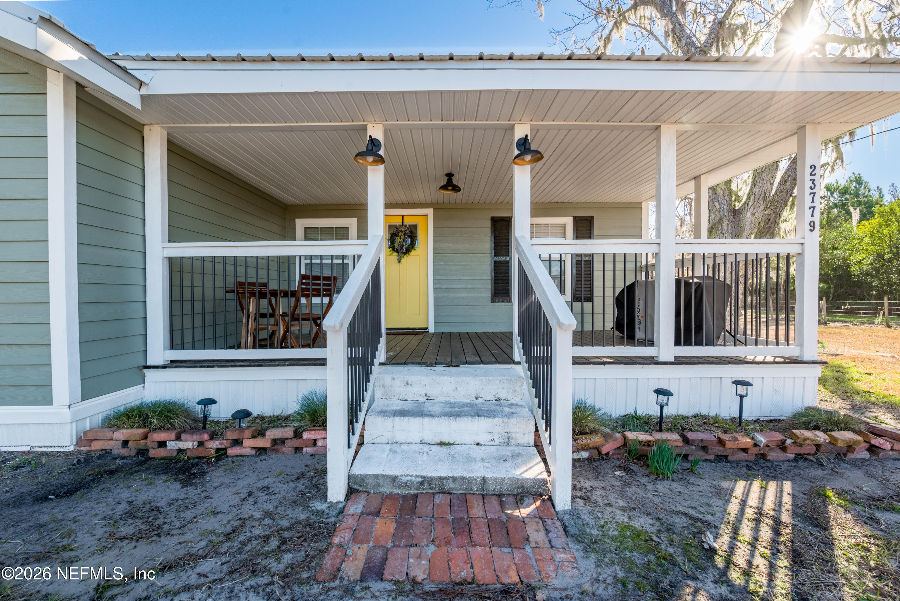 23779 Northwest 225a Road, Unit COUNTY Starke, FL 32091 - Photo 48 of 73 a front view of house with outdoor space