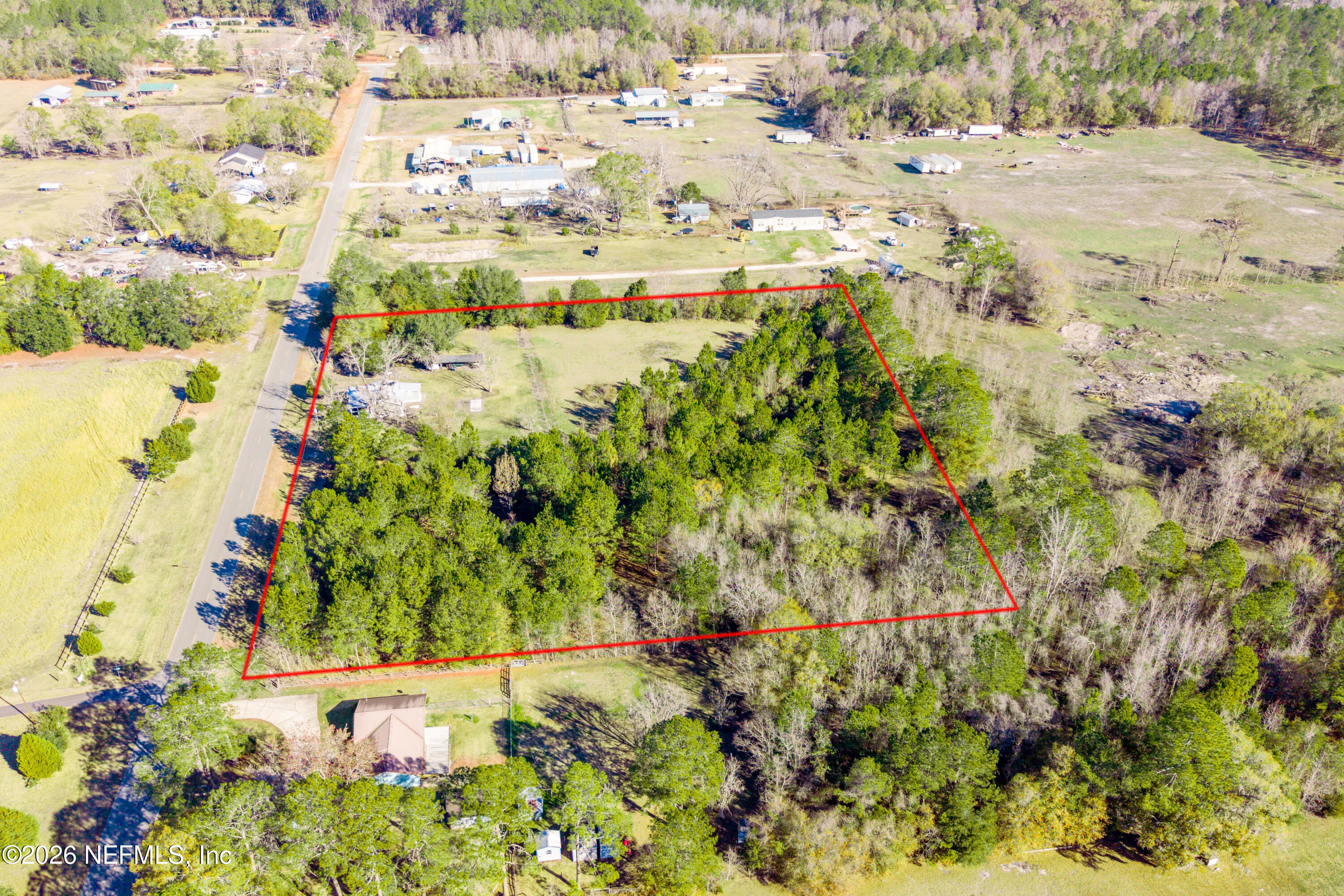 23779 Northwest 225a Road, Unit COUNTY Starke, FL 32091 - Photo 66 of 73 a view of a yard with a tree