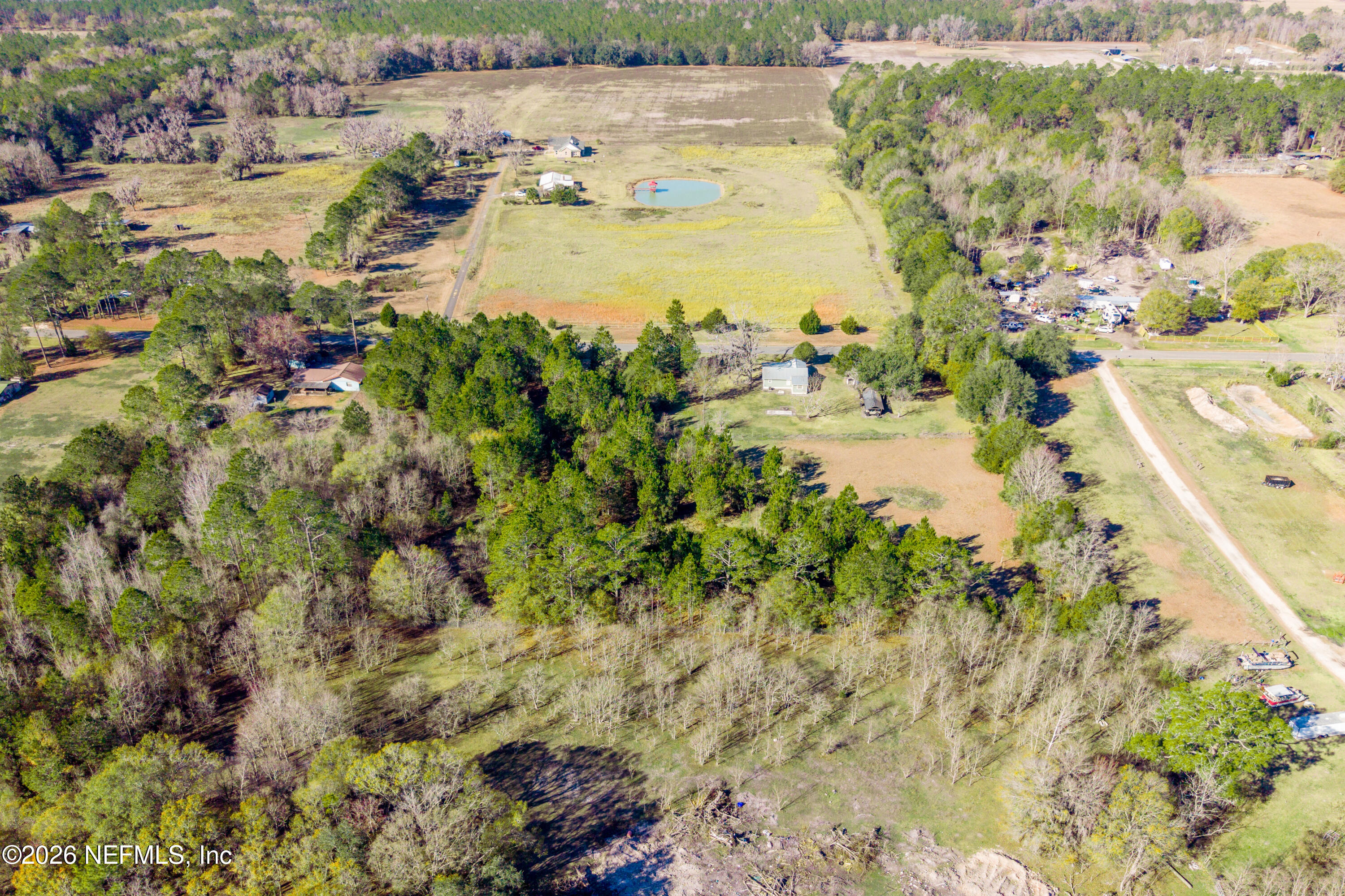 23779 Northwest 225a Road, Unit COUNTY Starke, FL 32091 - Photo 71 of 73 a view of a lake with houses in the back