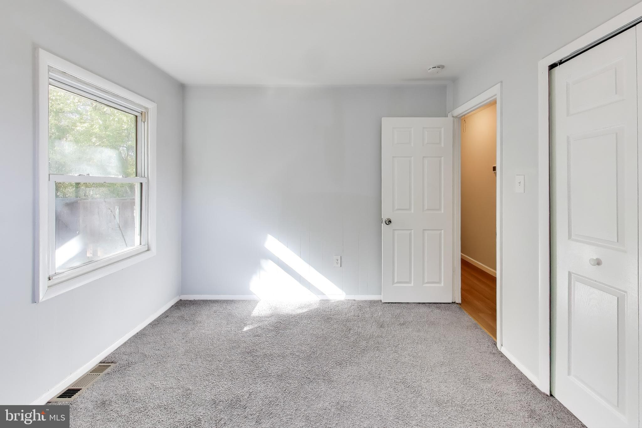 119 Jefferson Road Waldorf, MD 20602 - Photo 14 of 44 a view of an empty room with window and bathroom