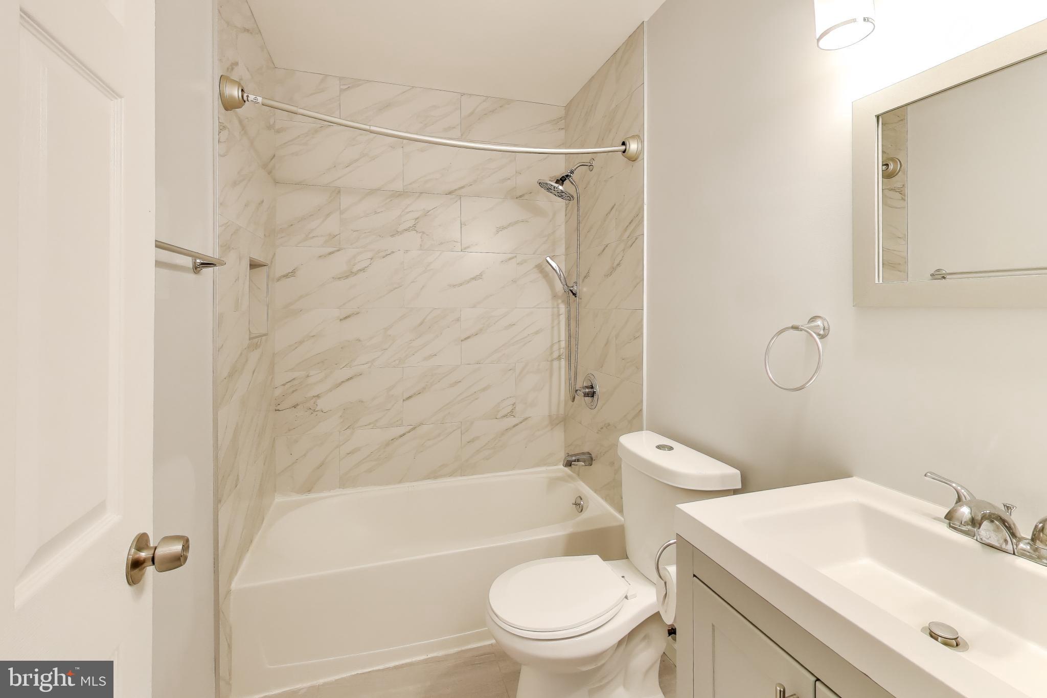 119 Jefferson Road Waldorf, MD 20602 - Photo 16 of 44 a bathroom with a sink toilet and shower