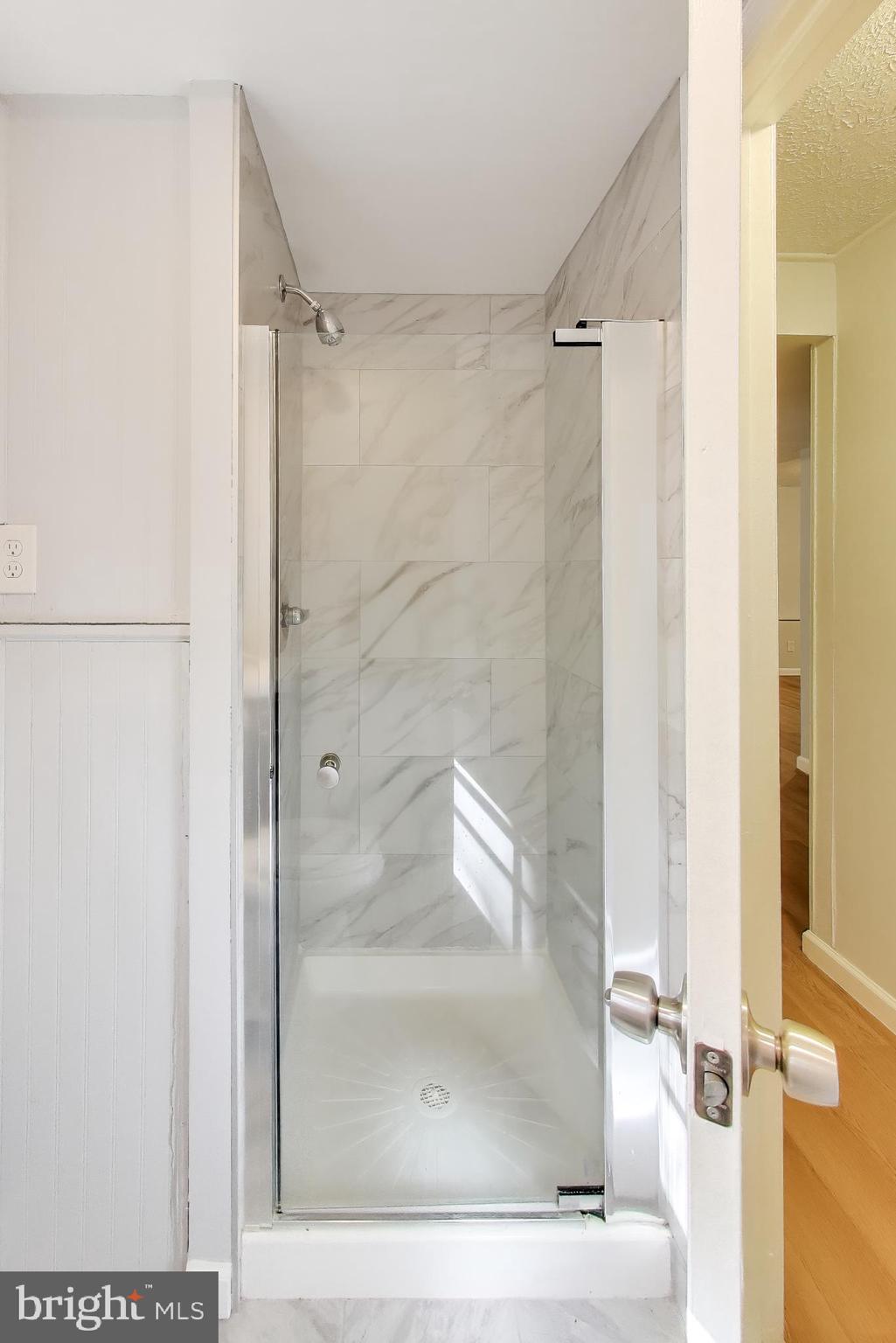 119 Jefferson Road Waldorf, MD 20602 - Photo 30 of 44 a bathroom with a glass shower door