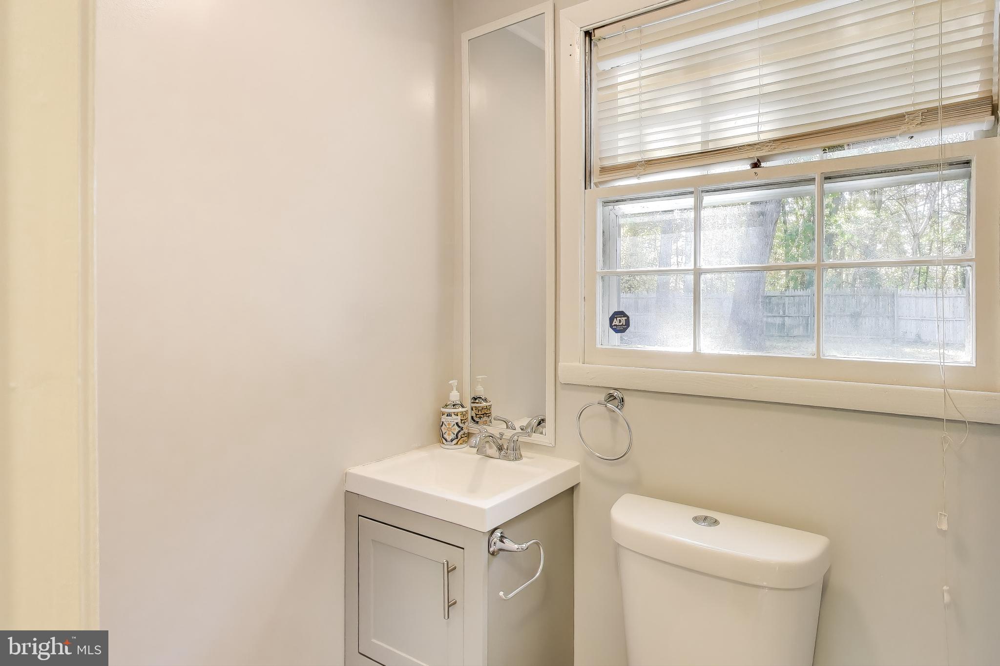 119 Jefferson Road Waldorf, MD 20602 - Photo 31 of 44 a bathroom with a sink a toilet and a window