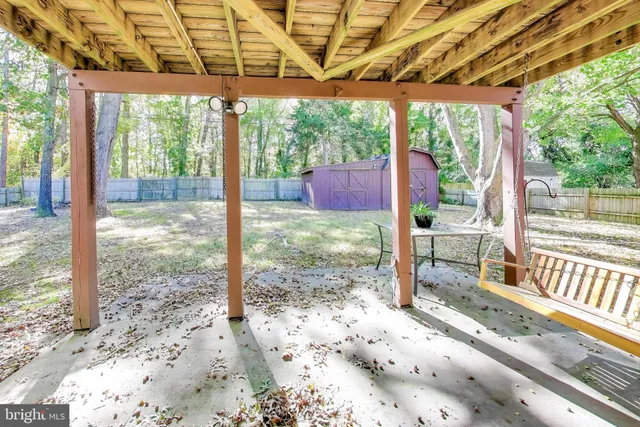 a view of a porch with a backyard