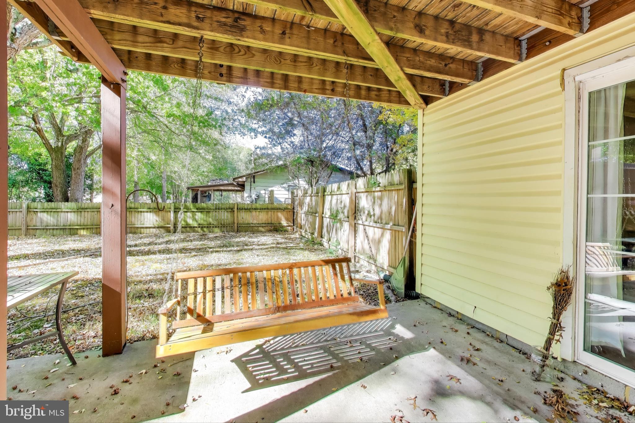 119 Jefferson Road Waldorf, MD 20602 - Photo 36 of 44 a view of a porch with a floor to ceiling window next to a yard
