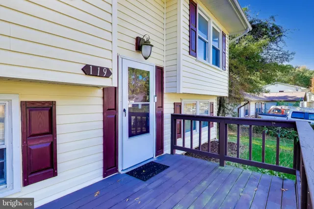 a view of a house with a porch and wooden floor