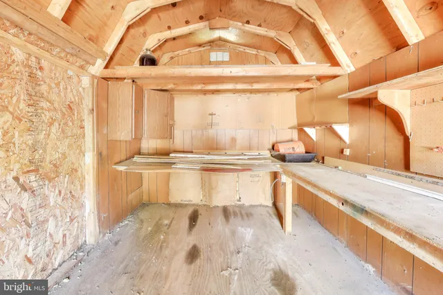 a large white kitchen with a sink and dish washer
